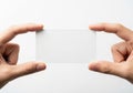 Two hands holding a transparent rectangular object against a plain background isolated on white background Royalty Free Stock Photo