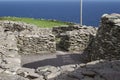 Ancient stone beehive hut colony of clochans, stone dry huts in rural Ireland