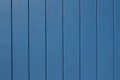 Exterior wall texture background with bright blue painted vertical wood siding Royalty Free Stock Photo