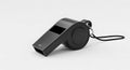 black referee whistle with lanyard on white Royalty Free Stock Photo
