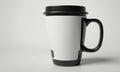black and white ceramic mug with handle and lid, placed on white surface. Royalty Free Stock Photo