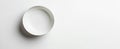 A single empty white bowl sits on a white background Royalty Free Stock Photo