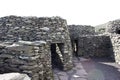 Colony of ancient stone beehive huts, or clochans, stone dry huts in Ireland