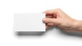 A hand holding a blank white rectangular card against a plain background Royalty Free Stock Photo