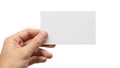 A hand holding a blank white rectangular card against a plain background Royalty Free Stock Photo