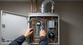 repairing a modern wall-mounted gas boiler system Royalty Free Stock Photo