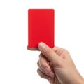 A close-up of a person holding a bright red rectangular object against a white background Royalty Free Stock Photo