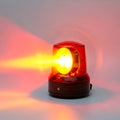 Bright red emergency beacon light emitting a focused beam on a reflective surface Royalty Free Stock Photo