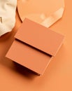 Close-up shot of a stack of orange notecards on a matching orange surface with a soft background Royalty Free Stock Photo