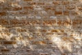 Texture background of a 19th century stone brick wall with restored mortar