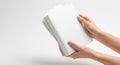 Close-up of hands holding a stack of blank white paper sheets Royalty Free Stock Photo