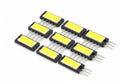 Assorted yellow and black rectangular electronic components with metal legs Royalty Free Stock Photo