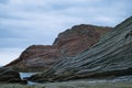 This image shows dramatic, layered rock formations along the rugged coastline of northern Spain. Royalty Free Stock Photo