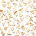 An image shows falling triangular tortilla chips as a type of snack food commonly referred to as nachos Royalty Free Stock Photo