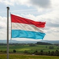 The image shows the flag of Luxembourg, featuring three horizontal stripes of red, Royalty Free Stock Photo