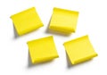 Four bright yellow sticky notes arranged in a square pattern on a white background Royalty Free Stock Photo