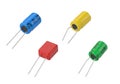 Assorted colored electronic capacitors displayed on a white background Royalty Free Stock Photo