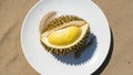 Durian Fruit Open on White Plate with Sand Background Exotic Dessert Royalty Free Stock Photo