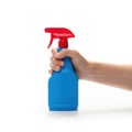 A hand holding a spray bottle filled with cleaning solution against a white background Royalty Free Stock Photo