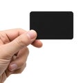 A hand holding a black rectangular object with a white background Royalty Free Stock Photo