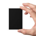 A hand holding a black rectangular object against a white background Royalty Free Stock Photo