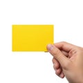 A hand holding a bright yellow rectangular card against a white background isolated on transparent background Royalty Free Stock Photo