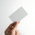 A hand holding a blank white business or identification card Royalty Free Stock Photo