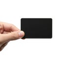 A hand holding a sleek black rectangular device resembling a credit card or digital gadget Royalty Free Stock Photo