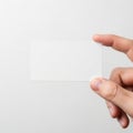 A hand holding a clear, rectangular object against a white background. isolated on transparent background Royalty Free Stock Photo