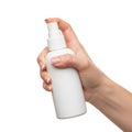 A hand holding a white spray bottle with a pump dispenser against a white background. isolated on transparent background Royalty Free Stock Photo