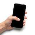 A hand holding a black smartphone with a dark screen against a plain background Royalty Free Stock Photo