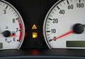 Dashboard warning light and fuel gauge illuminated in a vehicle\'s control panel Royalty Free Stock Photo