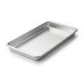 A large, empty, rectangular, stainless steel baking tray on a white background Royalty Free Stock Photo