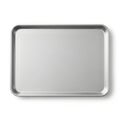 A large, empty, rectangular, stainless steel baking tray on a white background Royalty Free Stock Photo