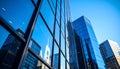 Lowangle view of glass skyscrapers reflecting blue sky and cityscape with black frames Royalty Free Stock Photo