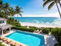 A luxurious beachfront villa with a swimming pool, lounge chairs, and a view of the ocean. Royalty Free Stock Photo