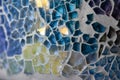 Macro texture of a mosaic pattern of colored glass pieces in ceramic ware