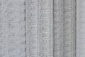 Vertical blinds fabric texture in a silver gray color Royalty Free Stock Photo