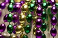 Macro abstract art texture background of bright traditional three colors of Mardi Gras beads Royalty Free Stock Photo