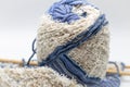 Skein of blue and white yarn and knitted cloth