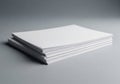 A neatly stacked pile of blank white paper sheets on a gray background Royalty Free Stock Photo