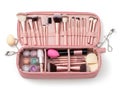 An open pink makeup case filled with various makeup brushes and beauty products Royalty Free Stock Photo