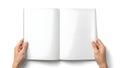 Hands holding an open blank book against a plain background Royalty Free Stock Photo