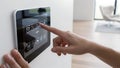 Person interacting with smart home control panel Royalty Free Stock Photo