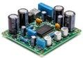 Electronic circuit board with multiple capacitors and a central microcontroller chip Royalty Free Stock Photo