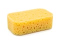 A yellow sponge bar with a textured surface for cleaning purposes Royalty Free Stock Photo