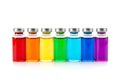 Vials of colored liquids in a row isolated on white background Royalty Free Stock Photo