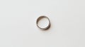 A silver ring on a white background. Royalty Free Stock Photo