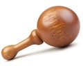 A single wooden maraca lays on its side against a white backdrop Royalty Free Stock Photo