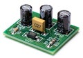Electronic circuit board with three cylindrical capacitors and a capacitor marked c27 Royalty Free Stock Photo